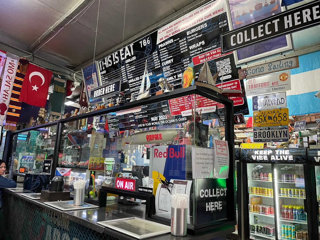 Inside This Is Eat — the counter, harbour memorabilia and the queue of happy regulars